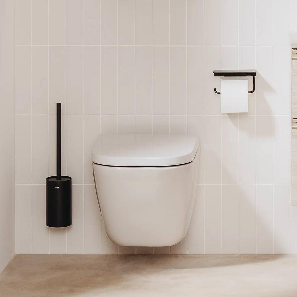 Lifestyle image of the Product lifestyle image of the Roca The Gap Square Wall Hung Toilet mounted on a tiled bathroom wall